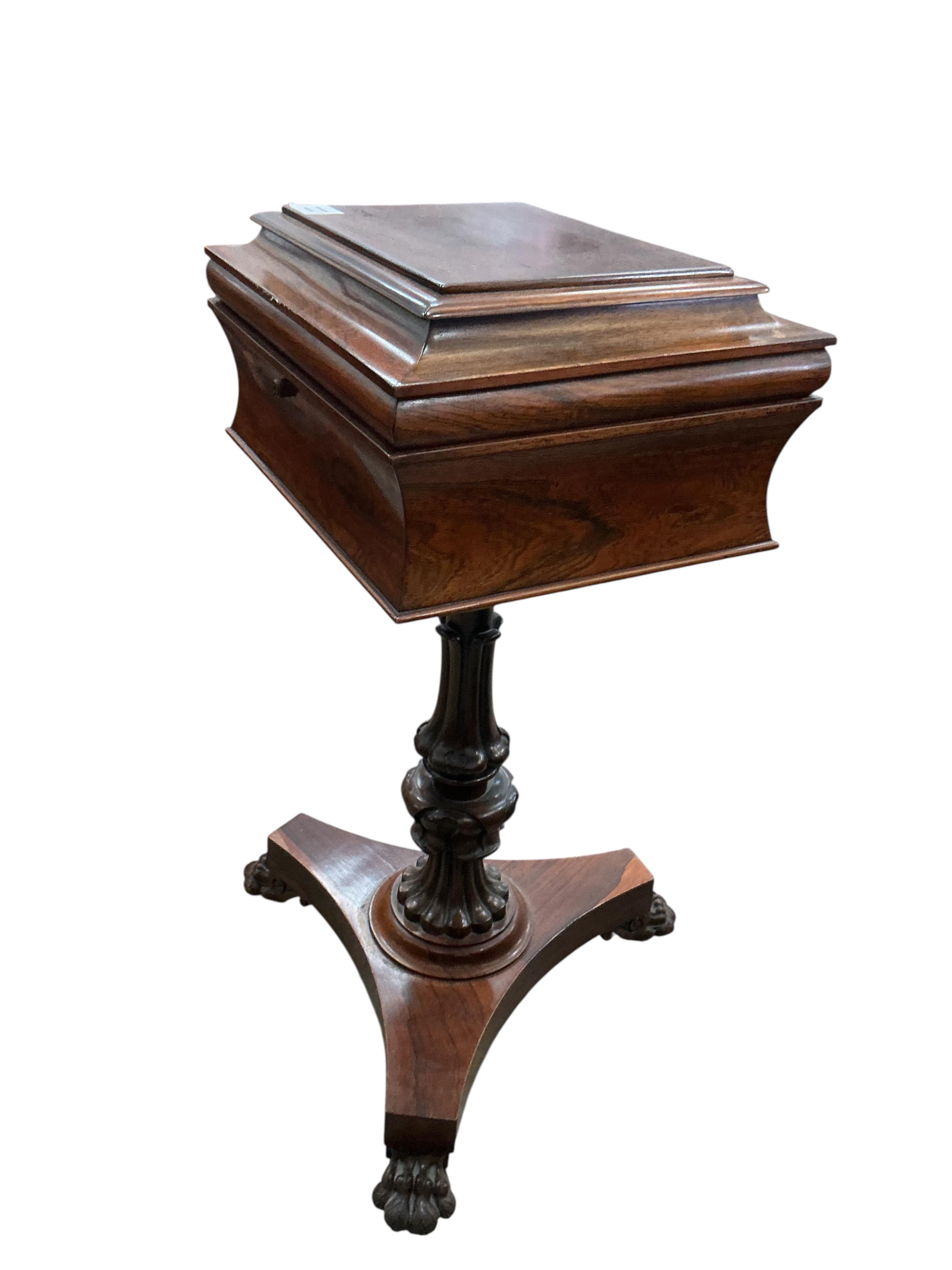 An early Victorian rosewood teapoy, on triangular platform and lion's paw feet, width 40cm, depth 33cm, height 78cm